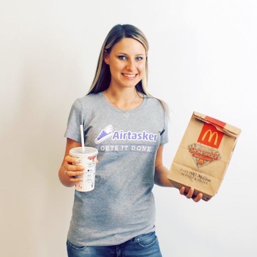 woman holding take away food from mcdonalds including drinks and